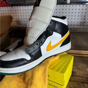 Black and White High-Top Sneakers with Yellow Swoosh